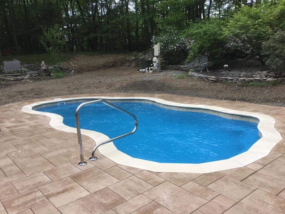 Finished pool with custom coping and paver installation