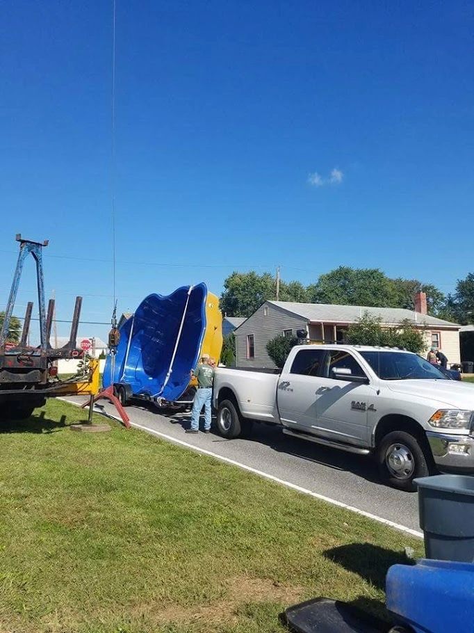 Commercial dump truck with custom pool hauling equipment