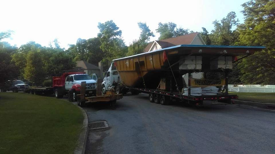 Oversized load truck transporting large pool structure