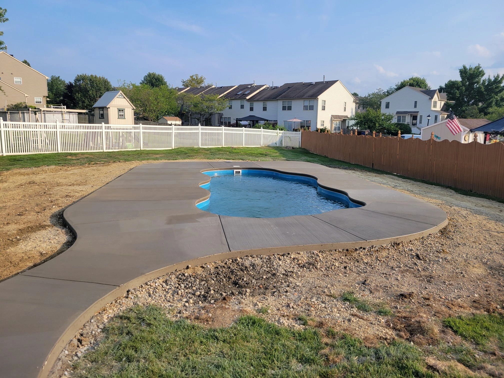 Latham fiberglass pool on a transport trailer — ready for delivery