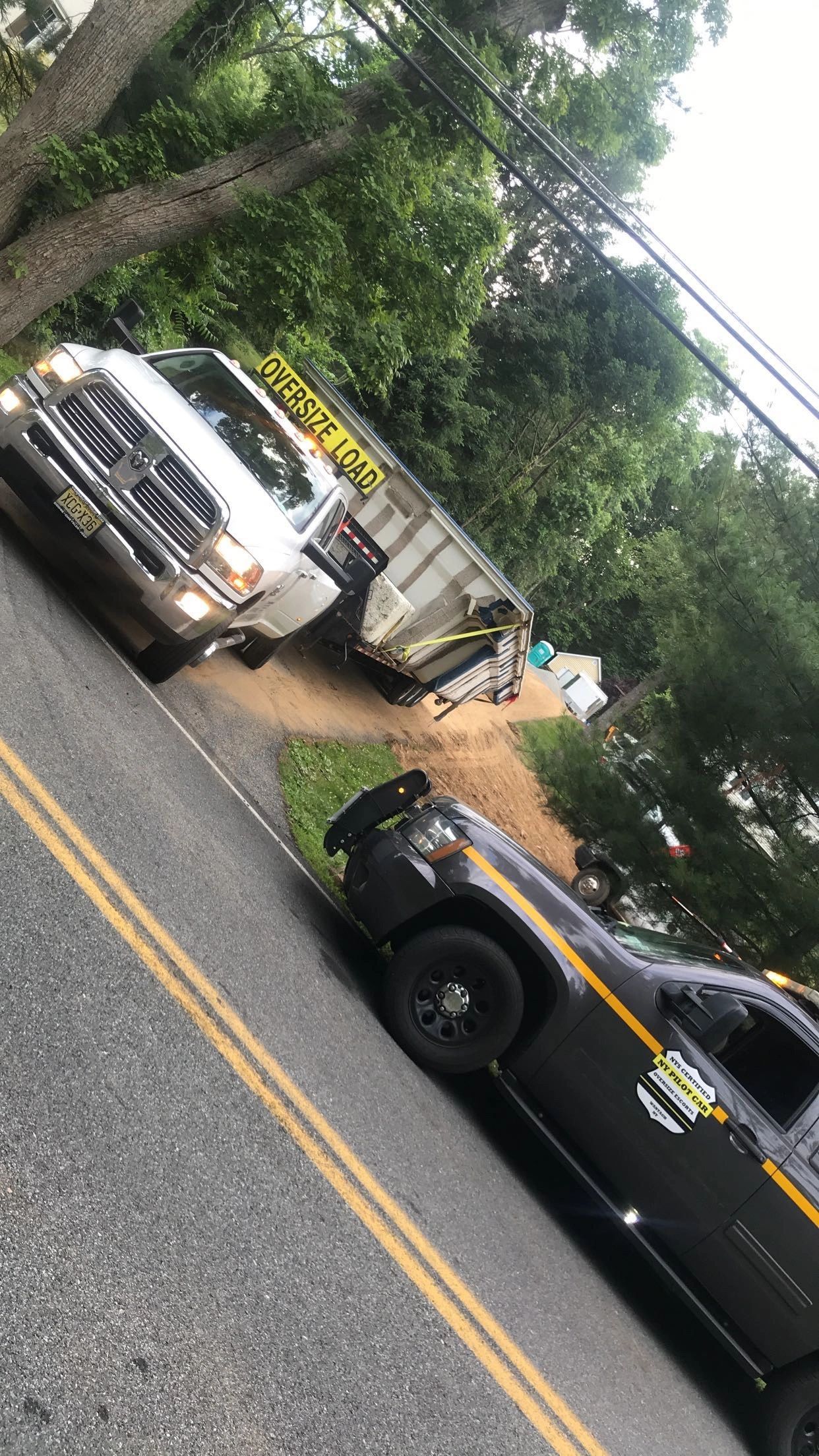 Heavy equipment and trucks at the North East Pool Distributors yard