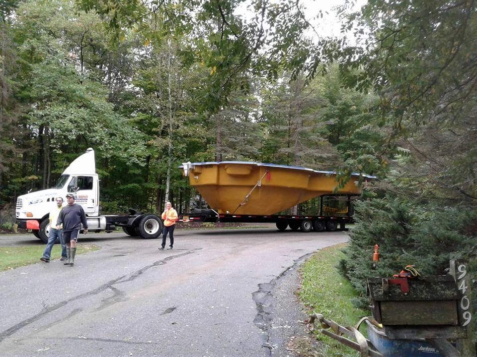 Oversized load truck with multiple pool trailers — North East Pool fleet