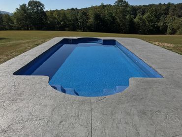 Fiberglass pool with deck surround