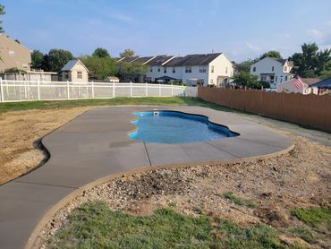Fiberglass pool in residential backyard
