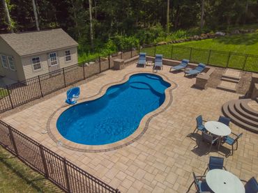 Completed pool installation with paver deck